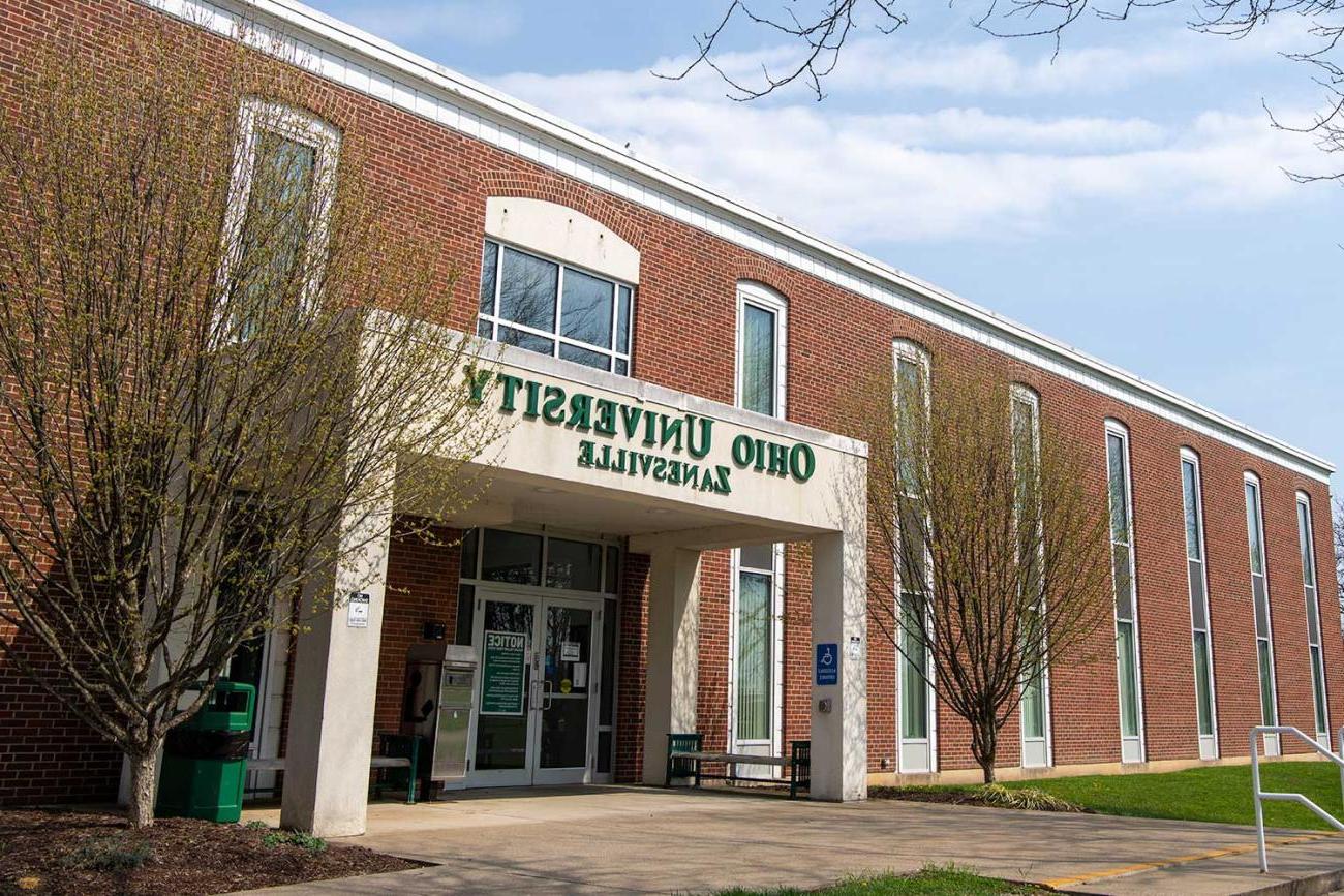 Shot of the front of a campus building on Zanesville campus, brick with white pillars